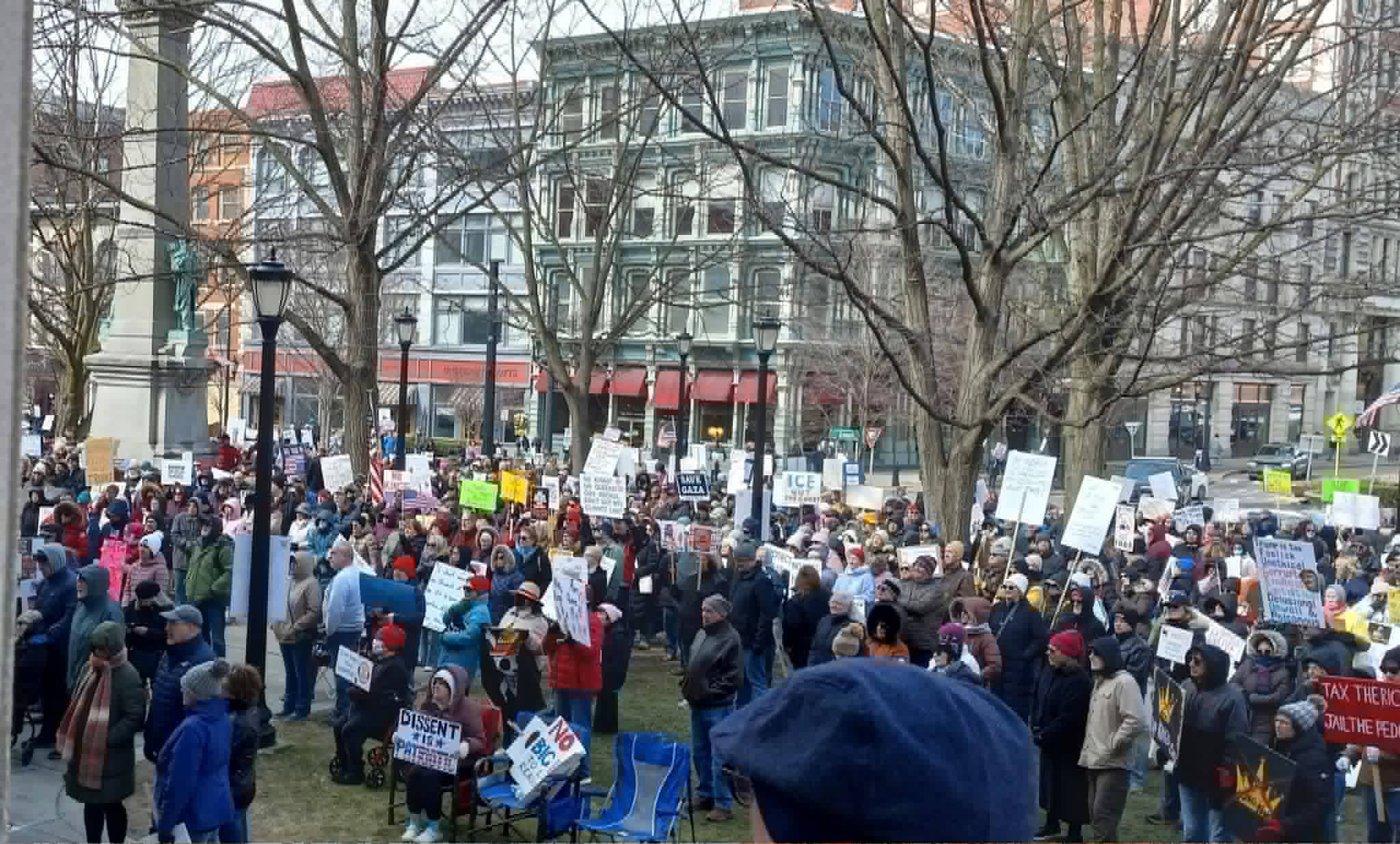 A large crowd fills the plaza with signs at the No Kings rally outside the Broome County Courthouse, March 2026