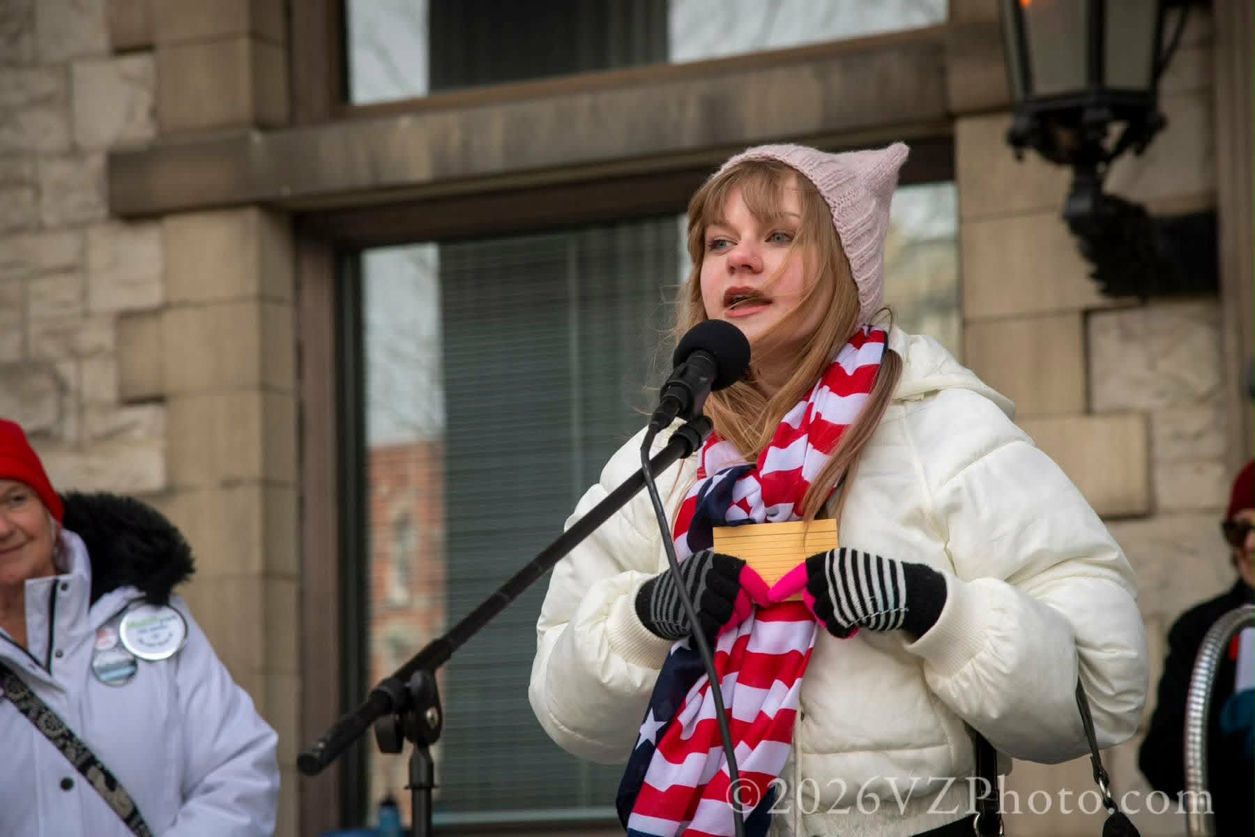 A speaker addresses the crowd from the Broome County Courthouse steps at the No Kings rally
